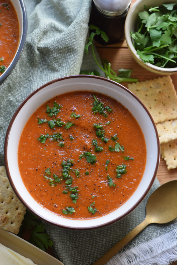 Tomato soup topped with herbs.