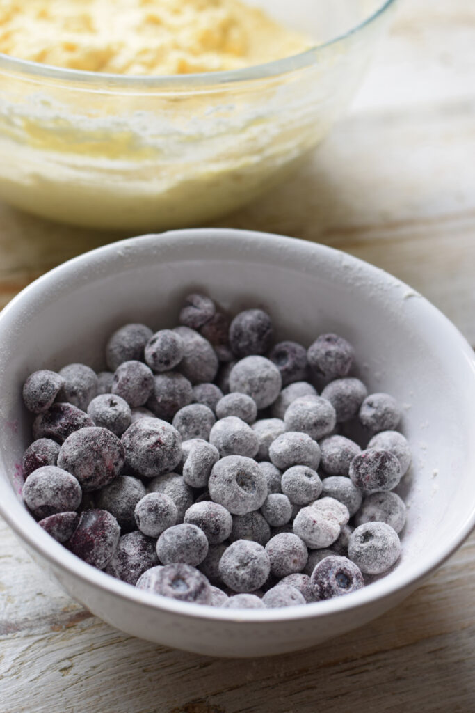 Blueberries tossed in flour in a bowl.