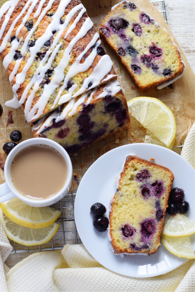 Lemon blueberry loaf with a cup of coffee.
