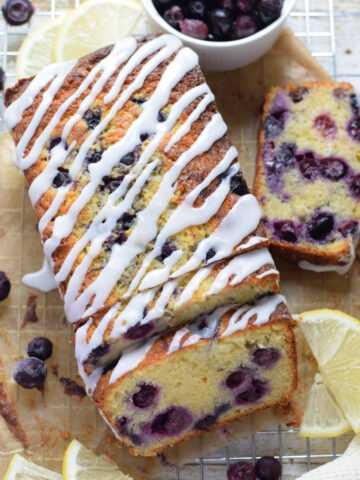 Lemon blueberry loaf cake with a cup of coffee.