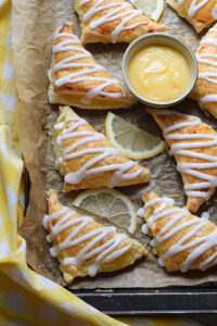 Lemon turnovers on a baking tray.