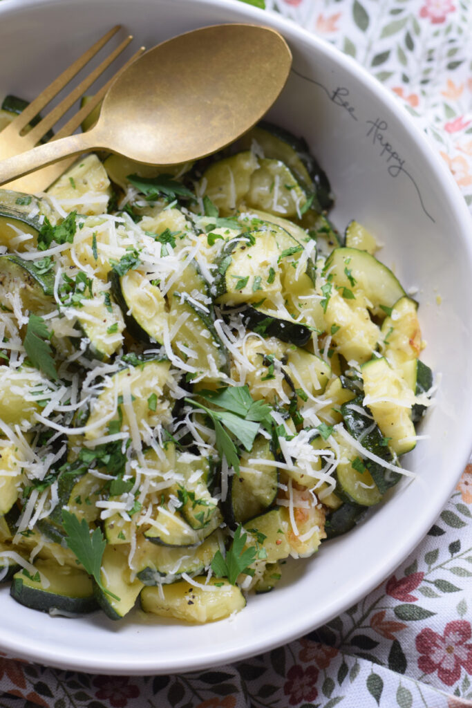 Parmesan topped zucchini in a bowl.