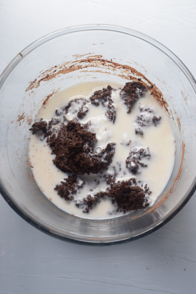 Making chocolate cupcake batter in a bowl.