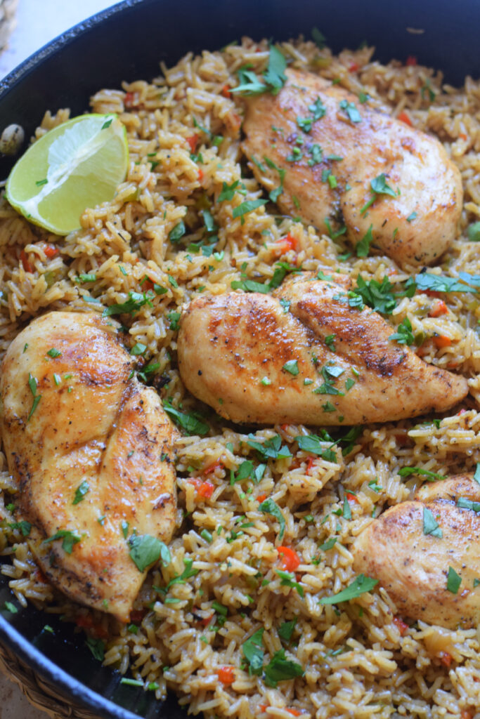 Chicken with rice close up in a skillet.