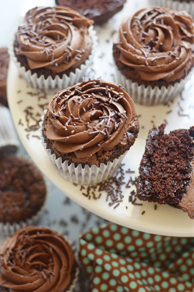 Chocolate cupcakes on a white tray.