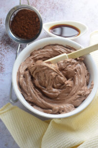 Chocolate frosting in a bowl.