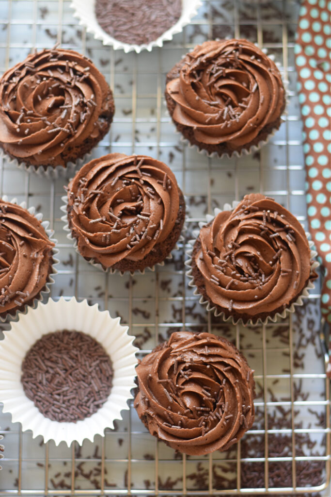 Chocolate cupcakes on a baking tray.