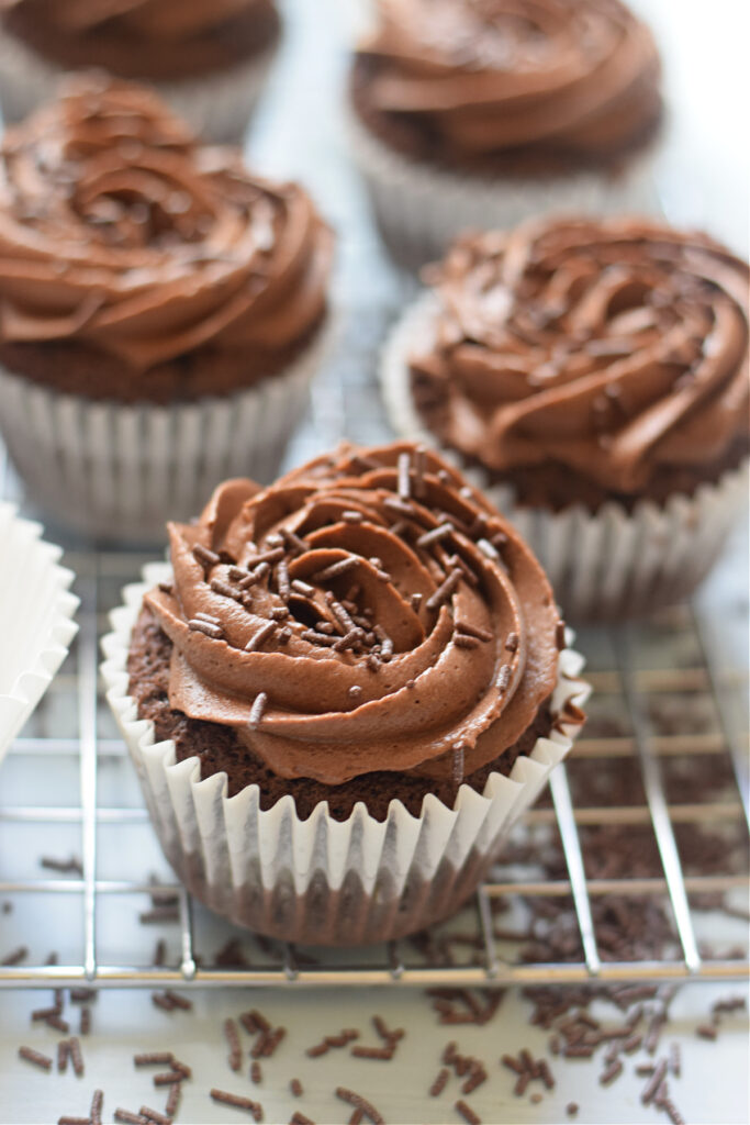 Close up of chocolate frosted cupcakes.