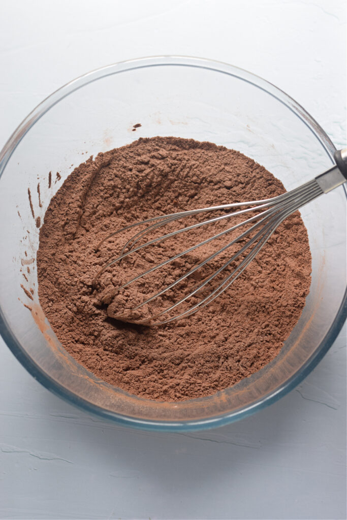 Dry ingredients in a bowl to make chocolate cupcakes.