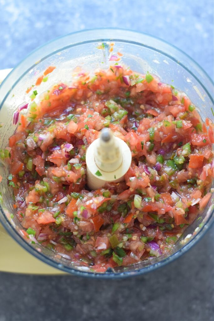 Spiced salsa in a food processor.