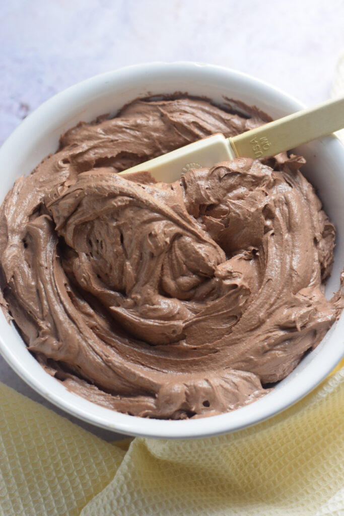 Close up of chocolate frosting in a bowl.