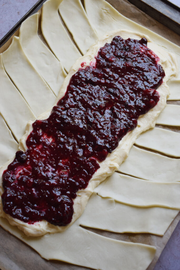 Berry filling on top of pastry.