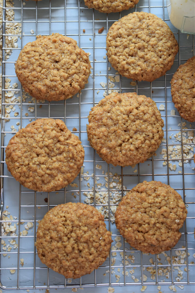 Oatmeal cookies on a cooling rack.