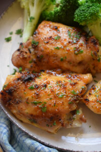 Close up of easy oven baked chicken thighs on a plate.