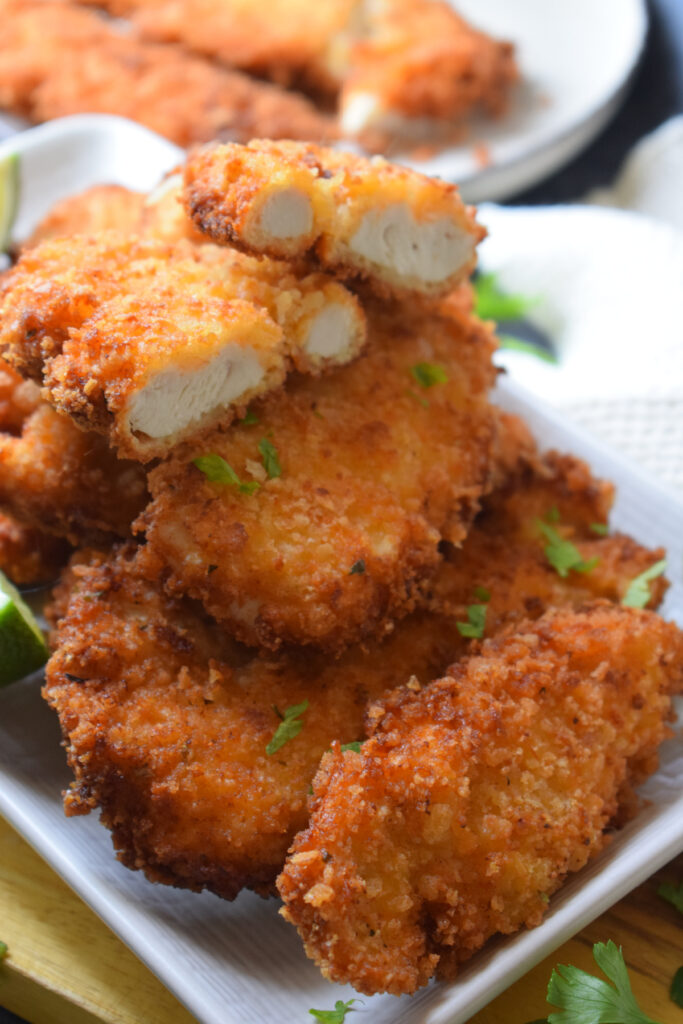 Close up of crispy fried chicken tenders.