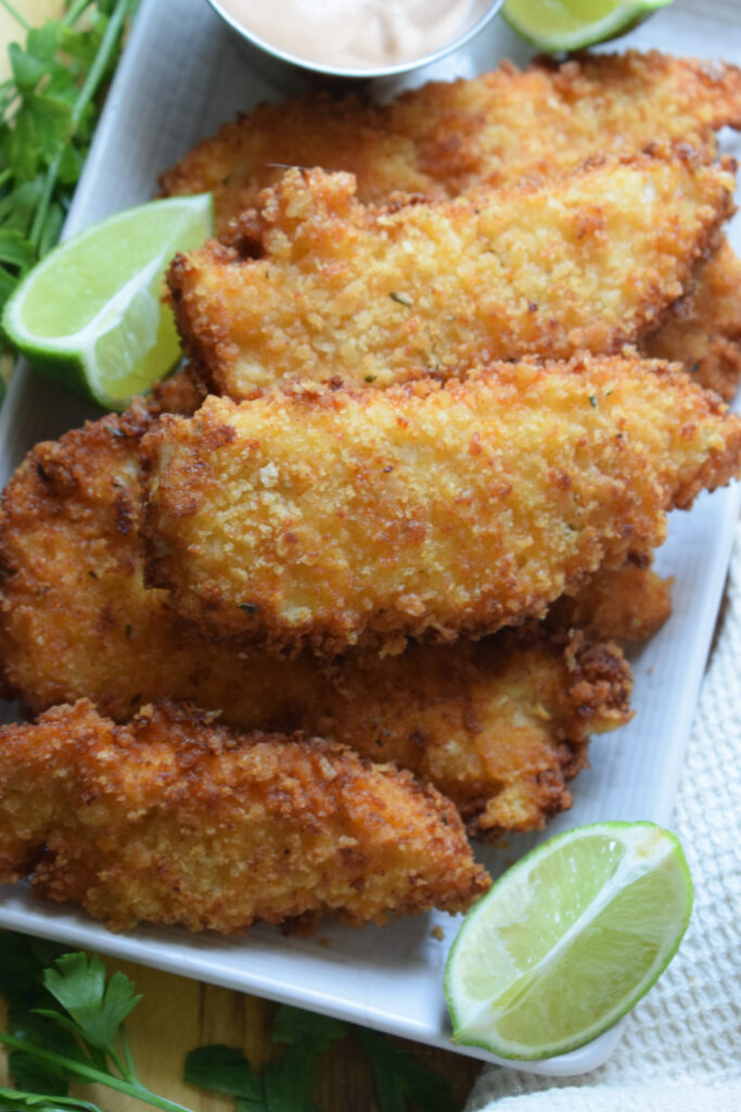 Close up of crispy fried chicken tenders.