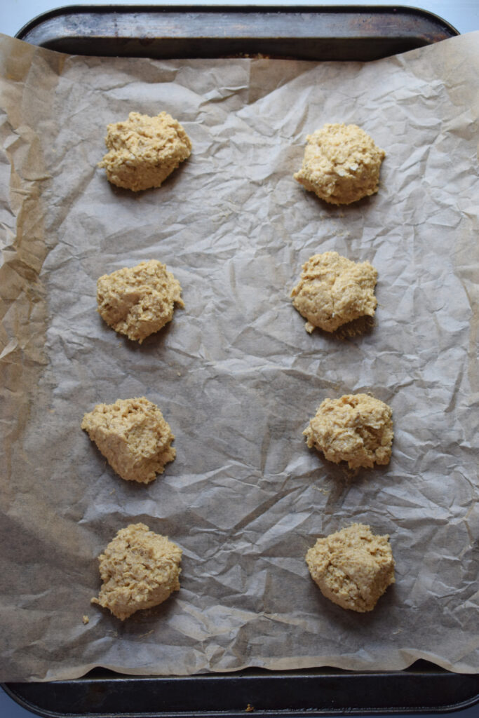 Cookie dough balls on a baking tray.