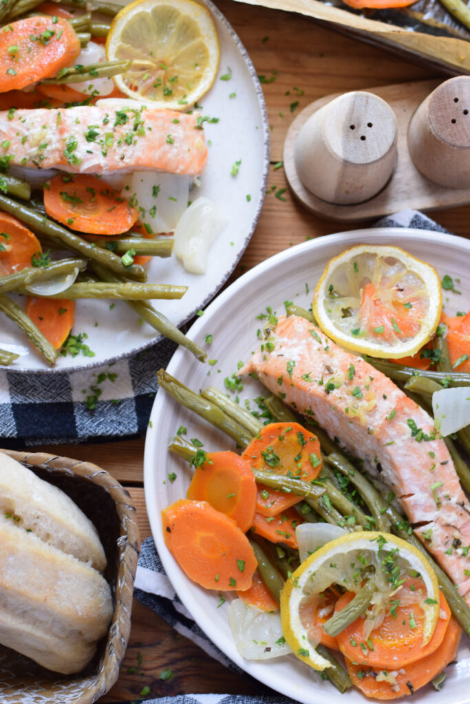 Salmon and vegetables on plates.