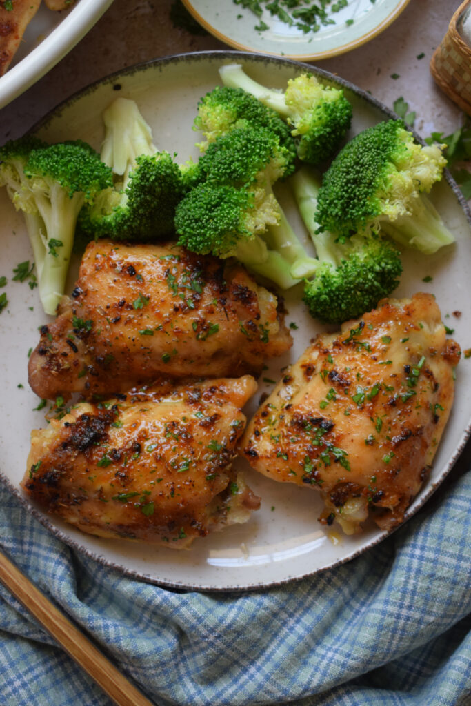 Easy oven baked chicken thighs with broccoli.