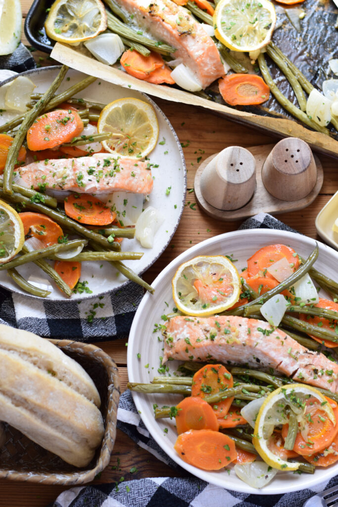 Salmon and vegetables on serving plates.