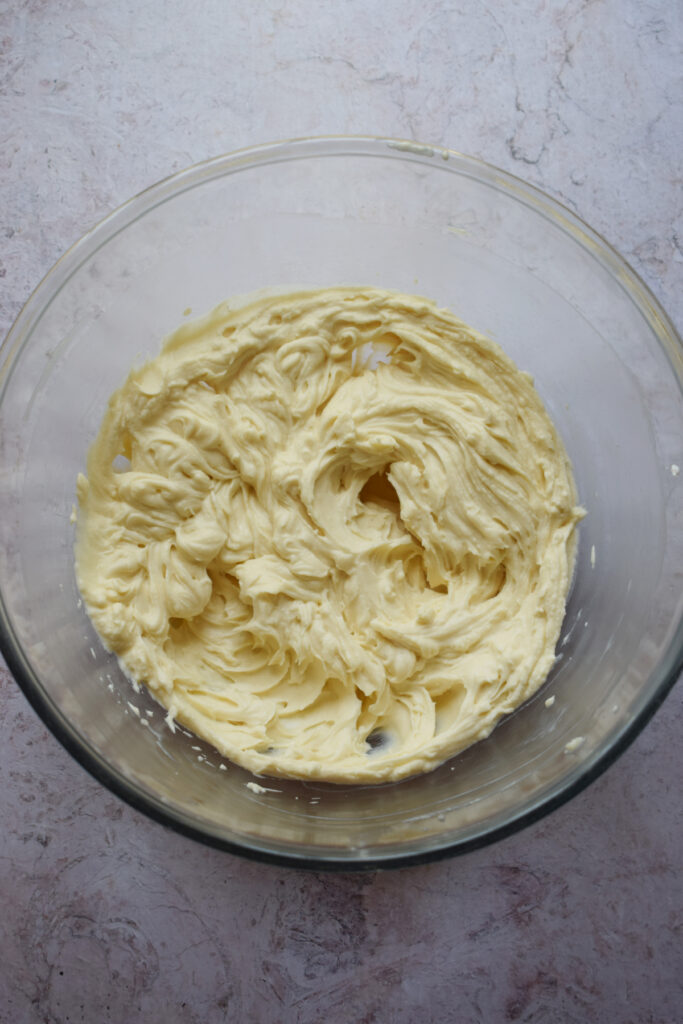 Cream cheese filling in a glass bowl.