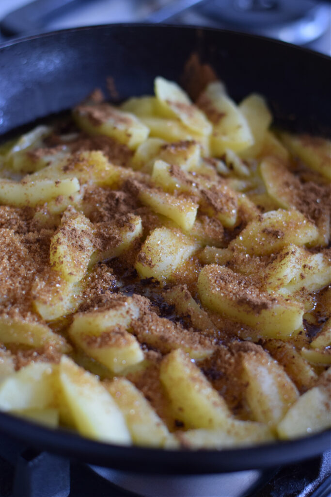 Cooking apples in brown sugar and cinnamon.