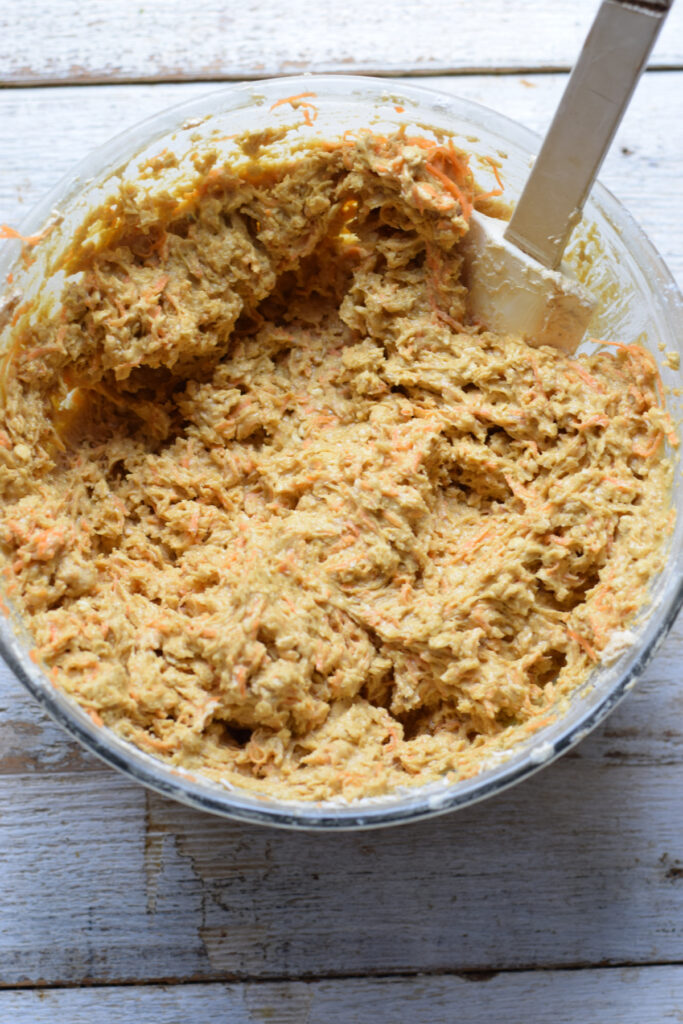 Carrot cake cookie dough in a bowl.