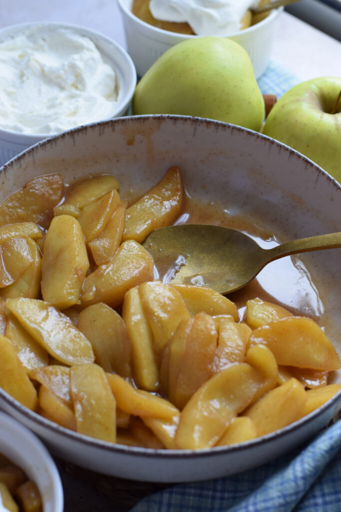 Caramelized apples in a bowl.