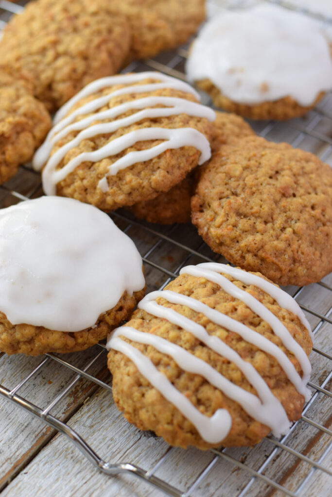 Carrot cake cookies on a baking rack.