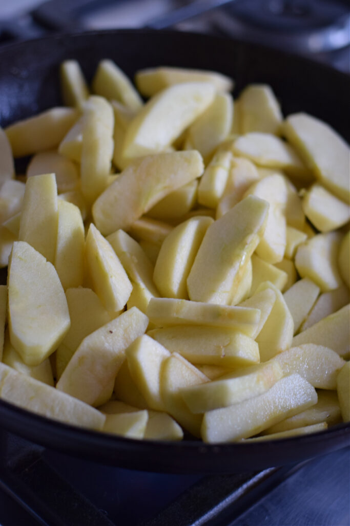 Cooking apples in a skillet.