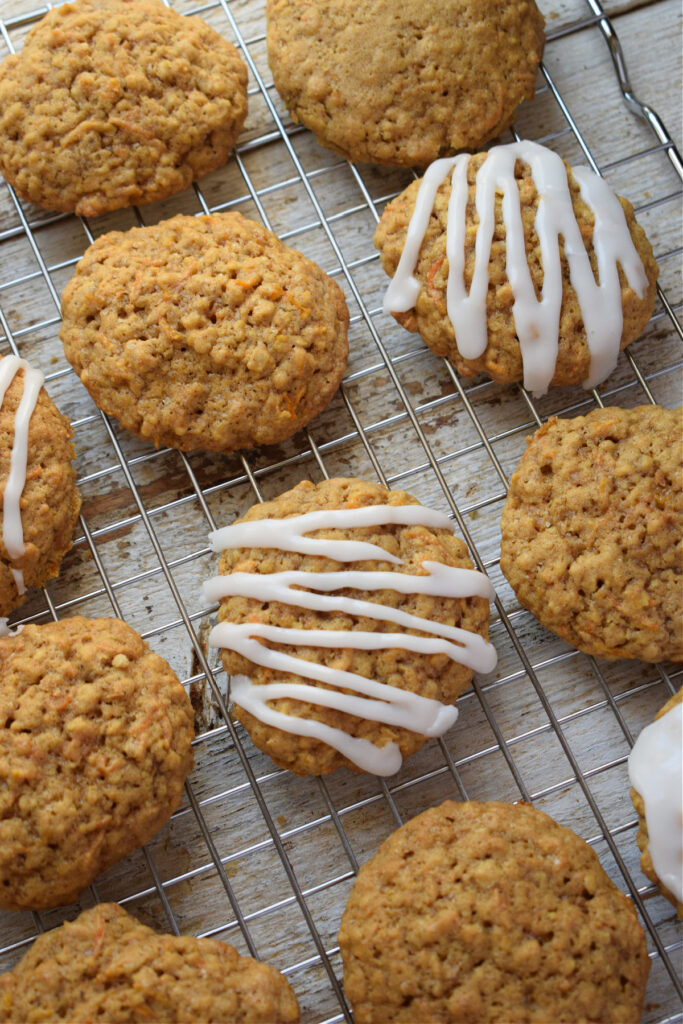 Spiced carrot cake cookies on a cooling rack.