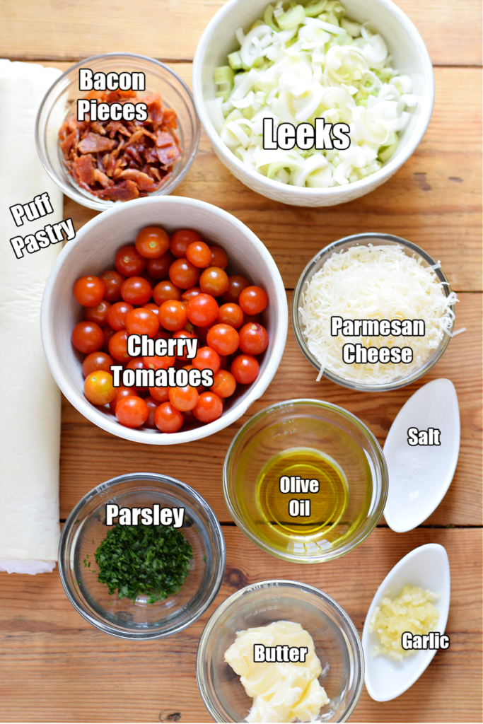 Ingredients to make tomato leek and bacon tarts.