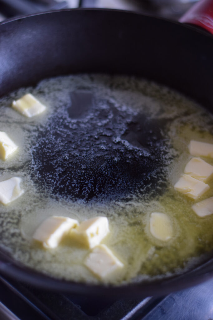 Add butter to a large skillet.