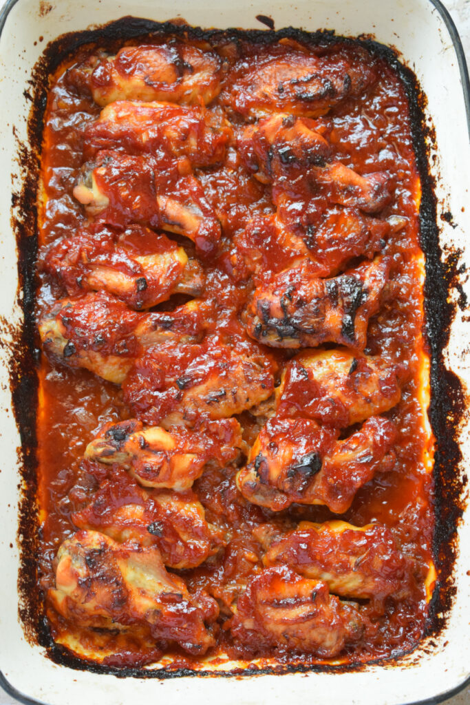 Baked chicken wings in a casserole dish.