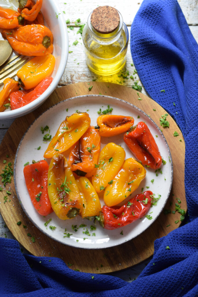 Roasted sweet mini peppers on a plate.