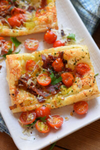 Close up of tomato leek and bacon tarts.