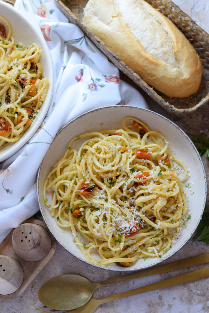 Roasted tomato linguine in a white bowl.