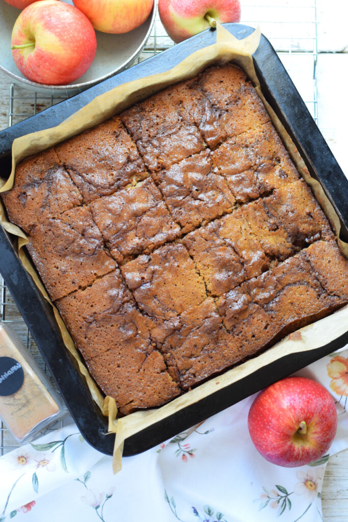 Apple spice cake squares in a baking pan.