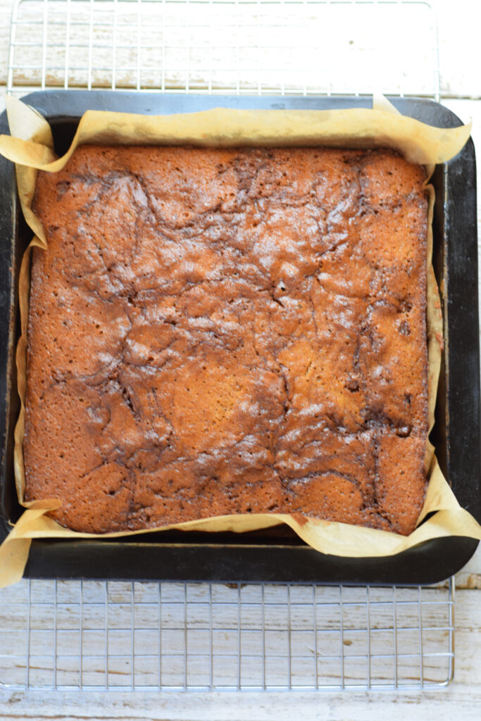 Baked apple squares in a baking pan.