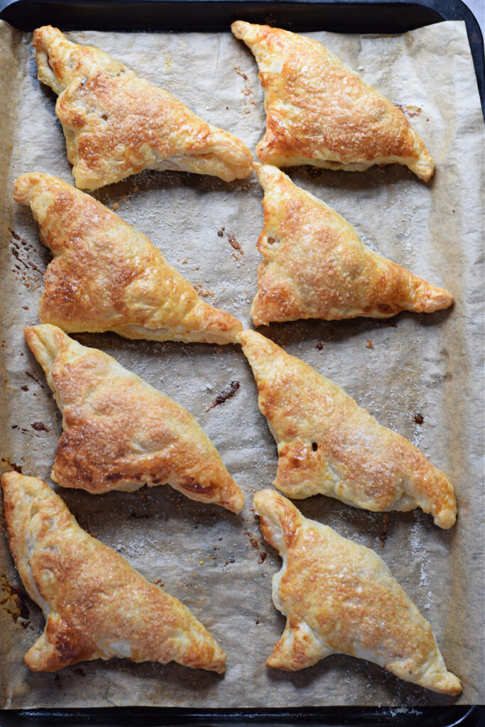 Baked pear puff pastry turnovers.