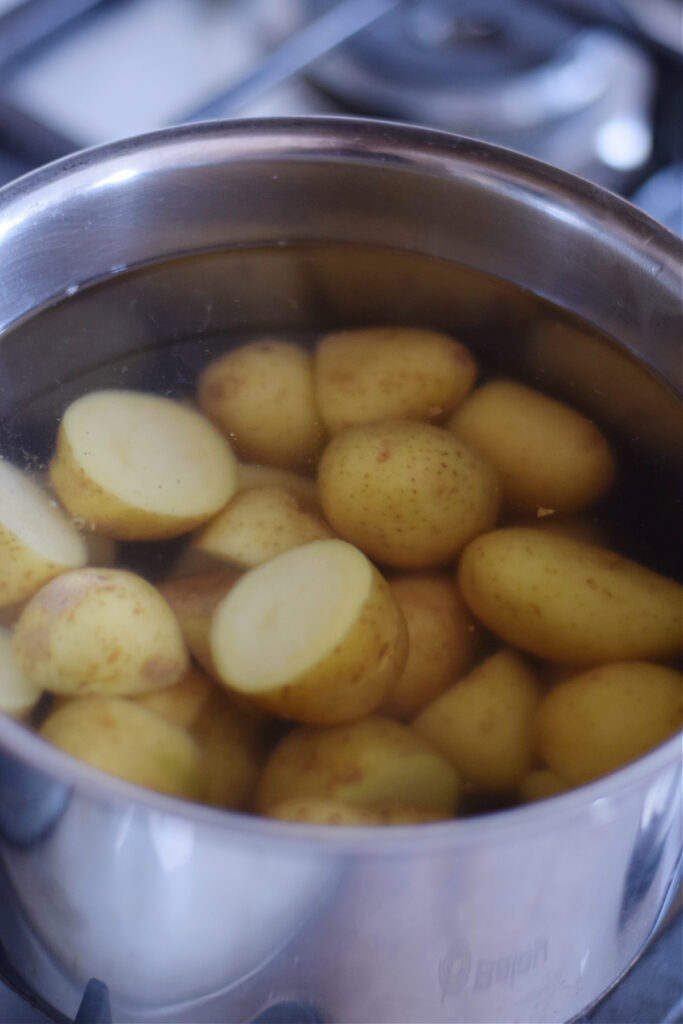 Boiling potatoes in a saucepan.