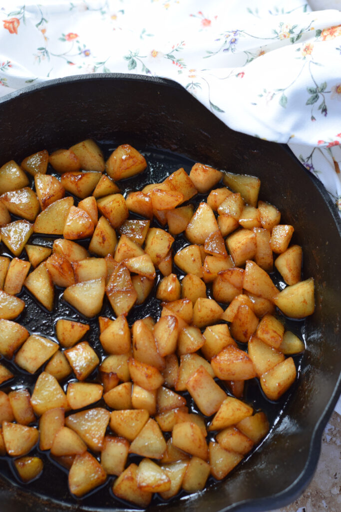 Caramelized pears in a cast iron skillet.