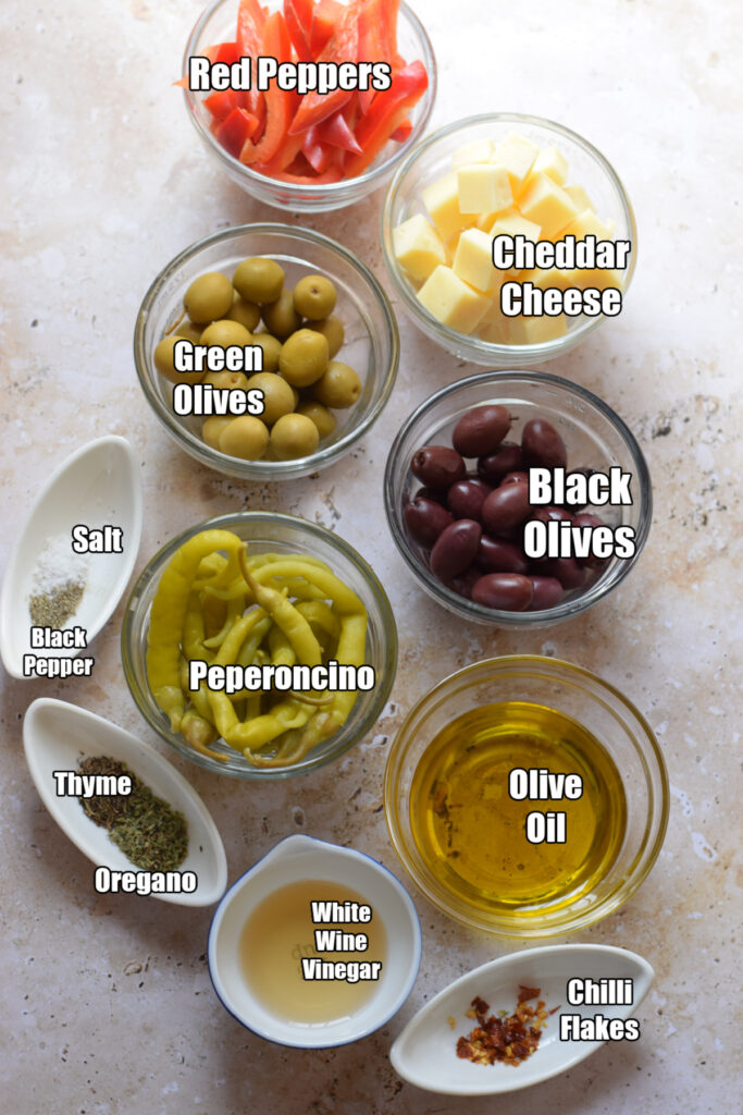 Ingredients to make marinated olives and cheese.