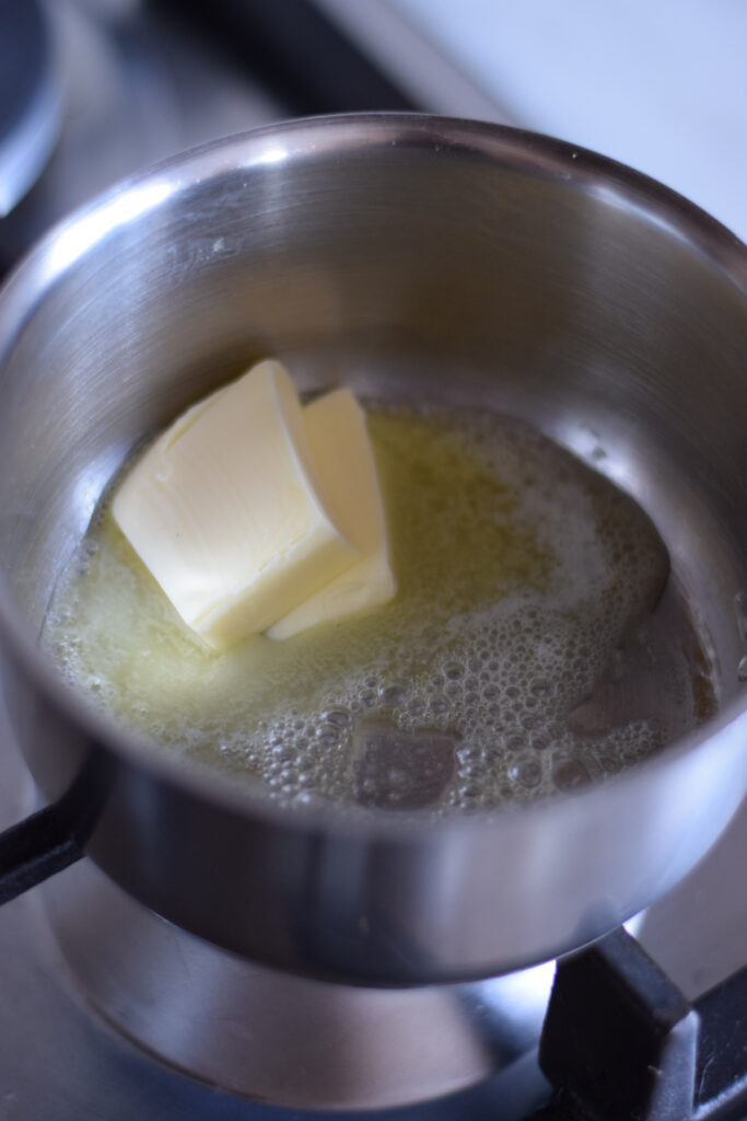 Melting butter in a saucepan.