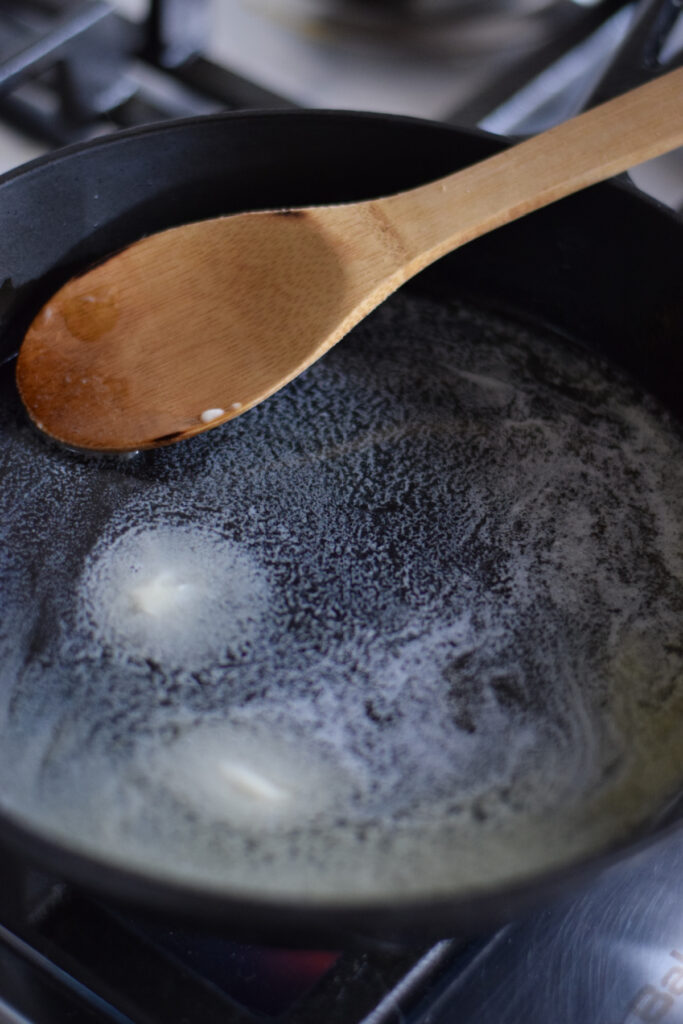 Cooking butter in a cast iron skillet.