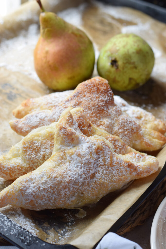 Close up of pear turnovers on a plate.