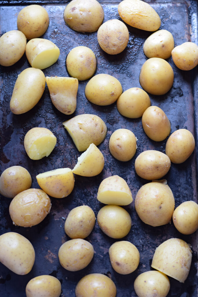 Potatoes on a baking tray.