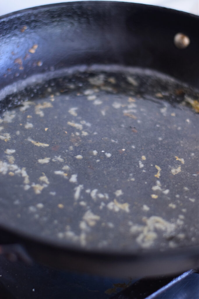 Making a sauce in a skillet.