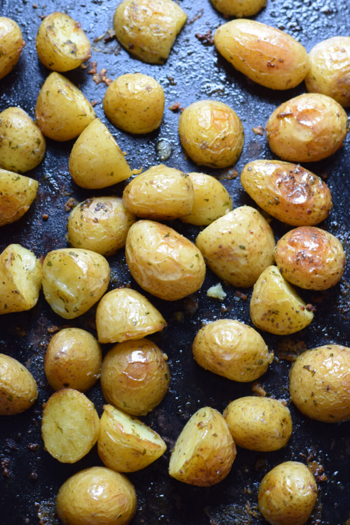 Garlic roasted potatoes on a tray.