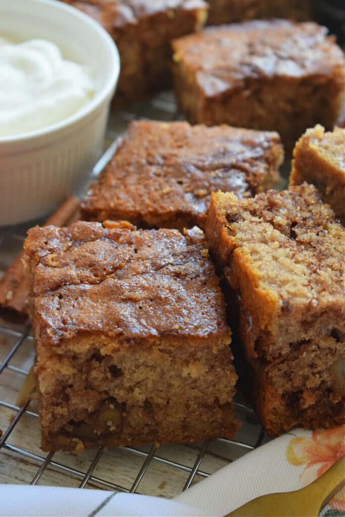 Apple cake squares with whipped cream.